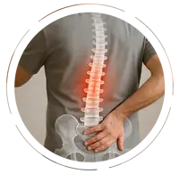 lder man wearing a gray T-shirt and jeans, touching his lower back, with a spine illustration highlighting spinal stenosis and a red glow indicating compression.